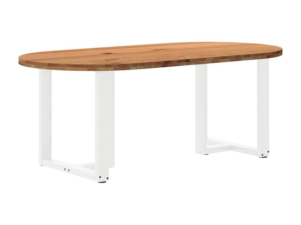 Light brown oval dining table made of solid oak
