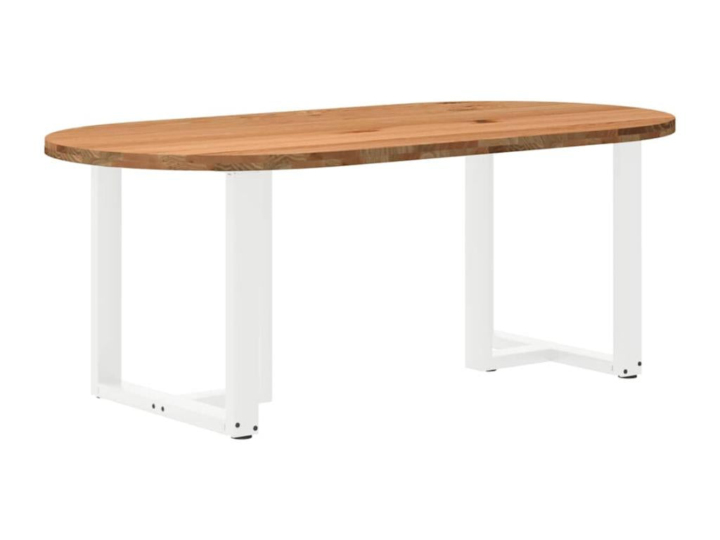 Light brown oval dining table made of solid oak